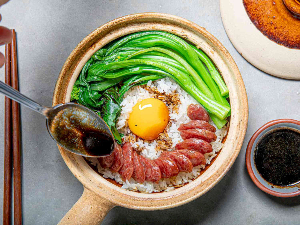 The combination of smoky aroma from the cooking process and tender rice creates a harmonious and satisfying meal 